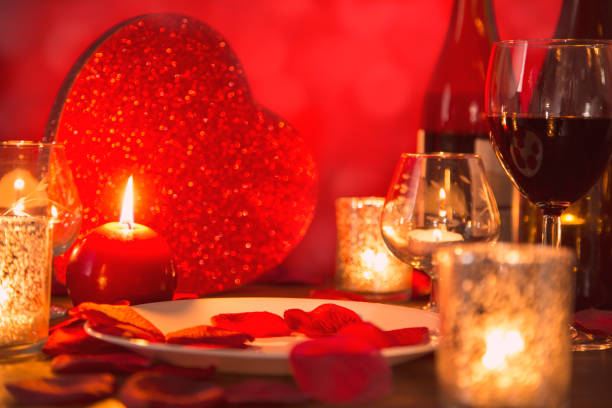 istock Valentine's Day romantic candlelight dinner with heart gift and wine. 904261968