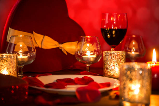 istock Valentine's Day romantic candlelight dinner with heart gift and wine. 904264472