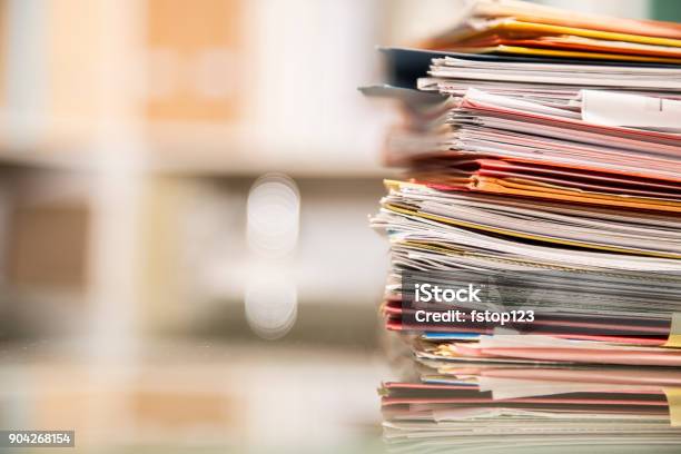 Large Stack Of Files Documents Paperwork On Desk Stock Photo - Download Image Now