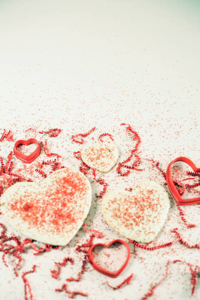 istock Valentine's Day cookies and cutters with red sprinkles. 904268766