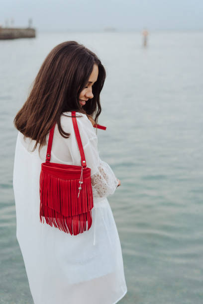 istock beautiful young girl with a handbag 904272144