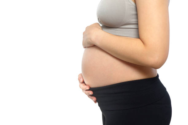 istock pregnant woman on white 904272626
