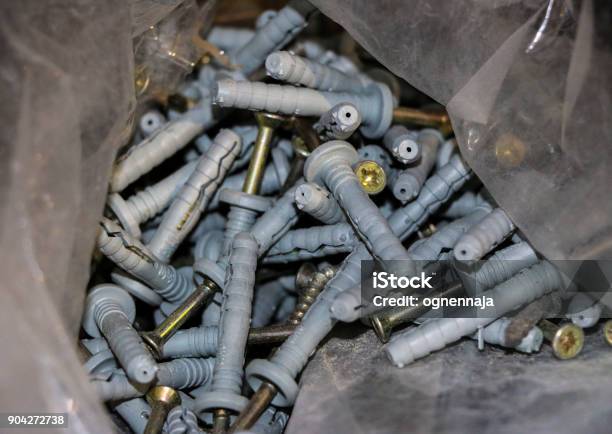 Long And Short Screws With Sharp Threads And Round Hats Stock Photo - Download Image Now