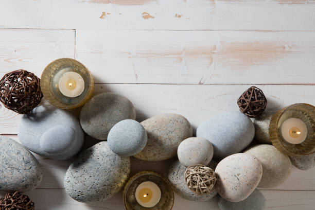 istock candles and mineral pebbles for mindfulness or serenity, flat lay 904275216