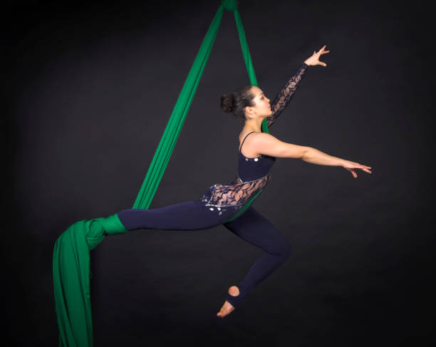 istock Young,smiling girl does exercises on the canvases. 904275358
