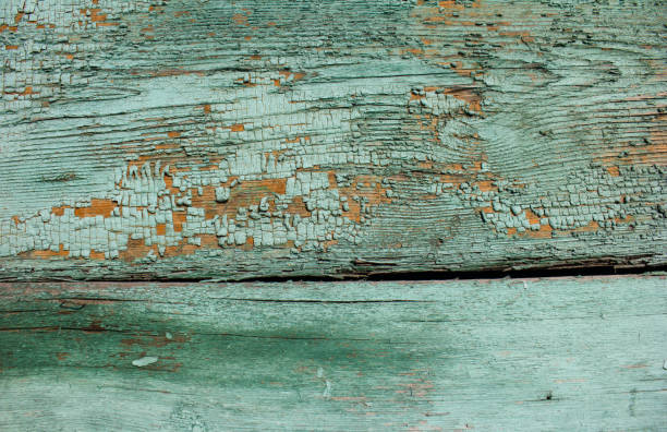istock emerald shade coloured cracked paint peeling on wood texture 904281878