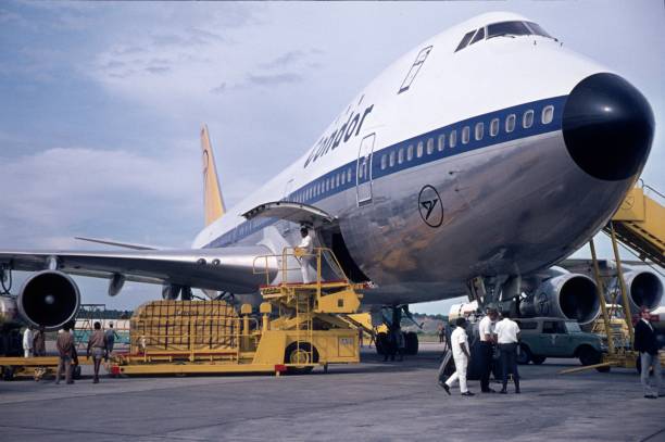 Colombo, Sri Lanka, 1971. A Boeing 747 is unloaded after landing from the airport personnel in Colombo and prepared with the compulsory service work for the next flight. In the 70s, the 747 was the largest passenger aircraft in the world.