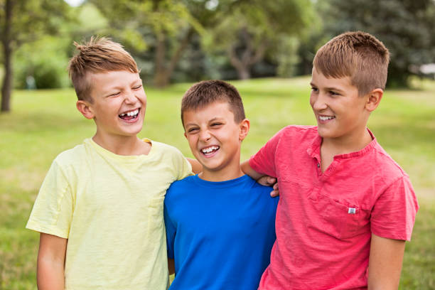 istock Three Happy Boys Outdoors 904288892