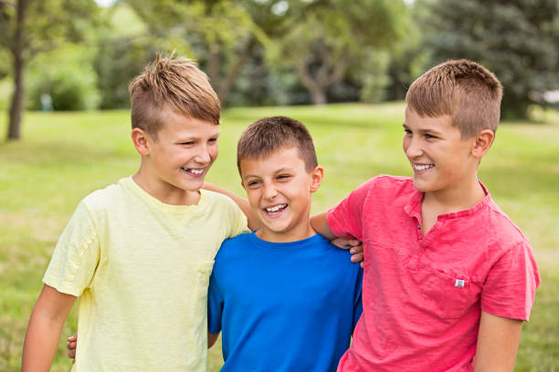istock Three Happy Boys Outdoors 904288894