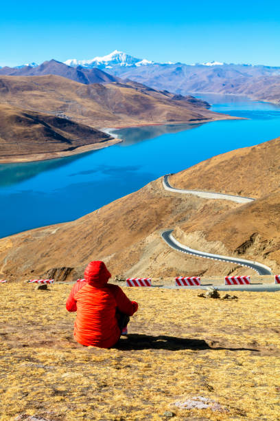istock Female hiker sitting on mountain 904290248