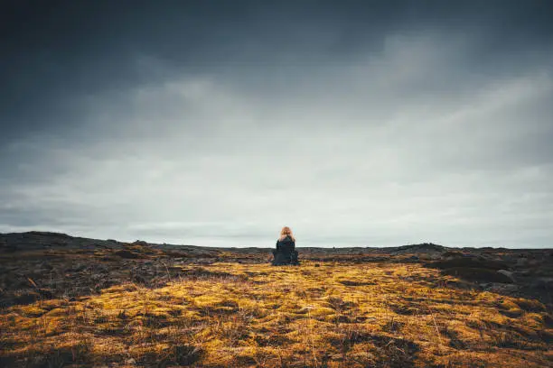 Photo of Woman Admiring The Volcanic Landscape In Iceland
