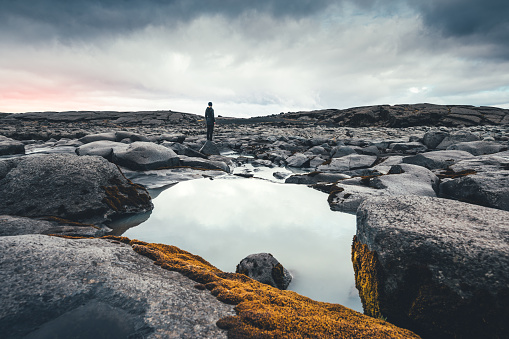 Woman admiring the icelandic wilderness.