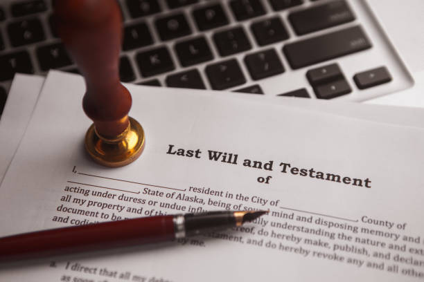 istock Notary's public pen and stamp on testament and last will. 904300134