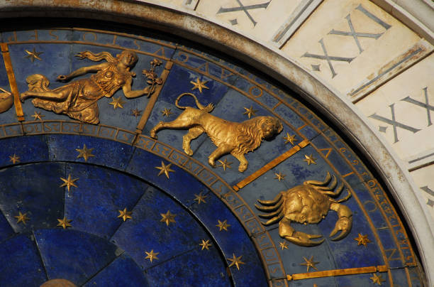 Astrology and Horoscope Ancient time and Astrology. Detail of Saint Mark Square renaissance Clock Tower in Venice with zodiac signs Leo, Cancer, Virgo, planet and stars (15th century) cancer astrology sign photos stock pictures, royalty-free photos & images