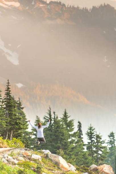 istock Bright Afternoon Sun Shines on Woman Leaping 904307688