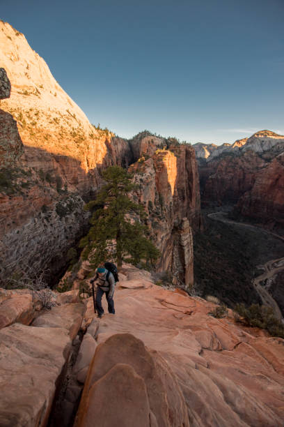 istock Woman Climbs up Steep Trail 904308698