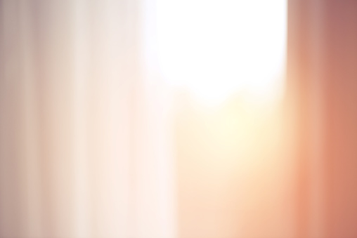 defocused window with a curtain