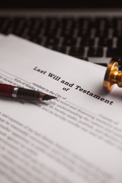 istock Notary's public pen and stamp on testament and last will. Notary public tools 904311734