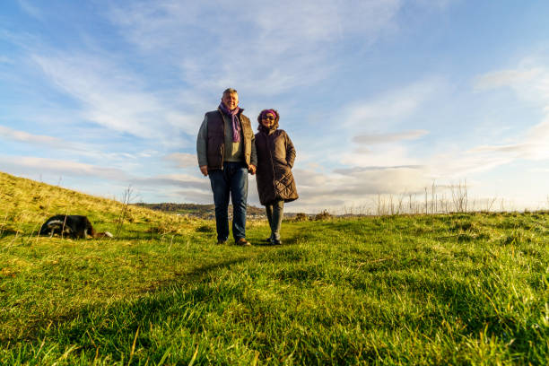 istock Senior couple walking on countryside path in winter 904312178