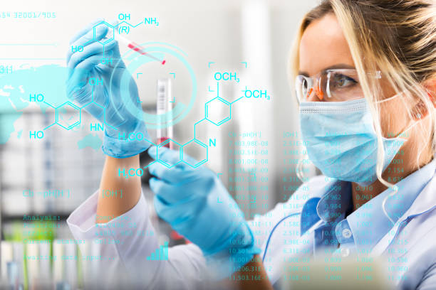 young attractive female scientist researching in the laboratory - research chemistry dna formula imagens e fotografias de stock