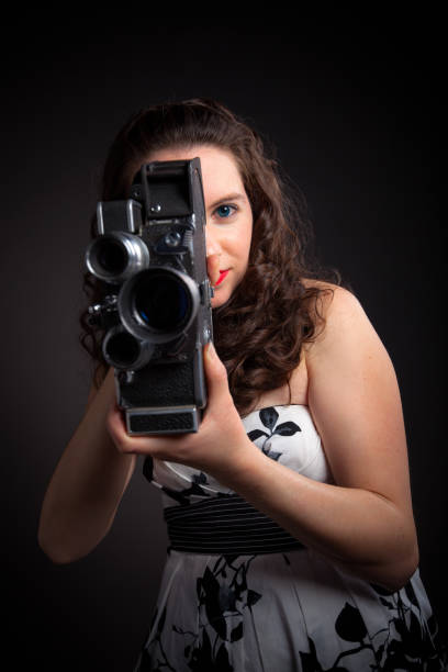 istock Woman with Vintage Film Camera 904317412