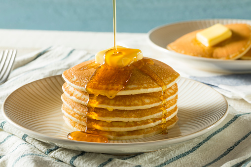 Sweet Homemade Stack of Pancakes with Butter and Syrup for Breakfast