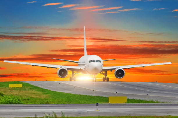 istock Passenger airplane taxis to the runway at sunset. 904324366