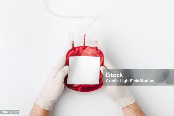 Top View Of Hands In Gloves Holding Blood For Transfusion Stock Photo - Download Image Now