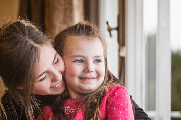 istock mother and little girl are hugging 904329280