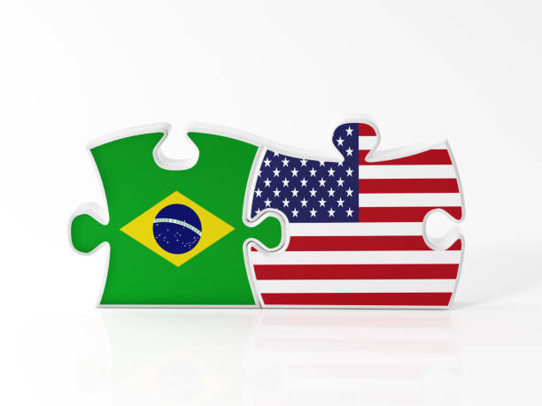 istock Jigsaw Puzzle Pieces Textured With Brazilian And American Flags 904335646