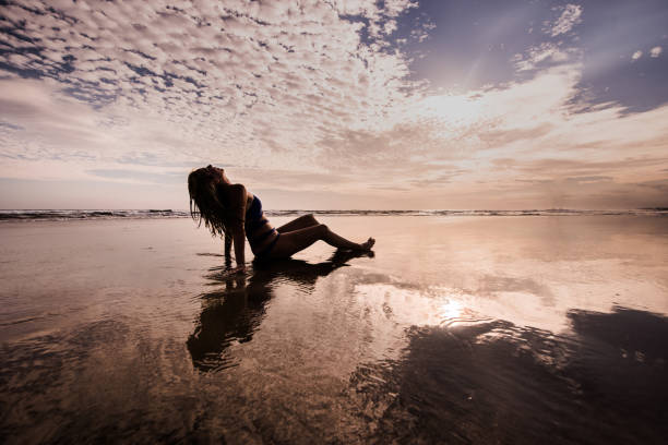 istock Female enjoying in view at seaside. 904343428