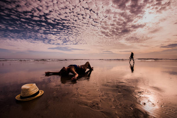 istock Sexy lady lying down on tropical beach. 904344384