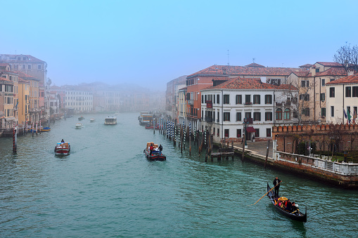 Grand Canal in Venice, Italy on a foggy winter day, view from the pier on \