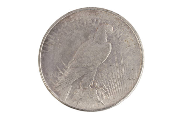 istock old vintage silver dollar isolated on background 904355418