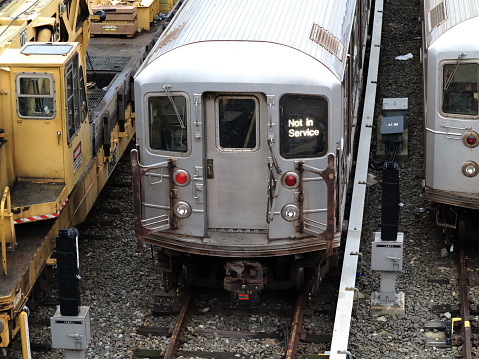 Commuter Train approaching a railyard junction in Queens, New York City.