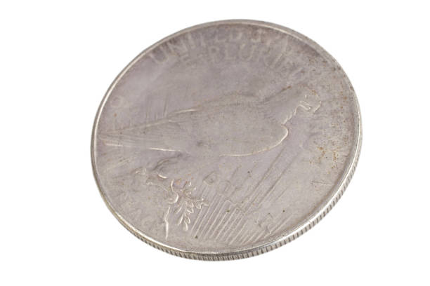 istock old vintage silver dollar isolated on background 904355716