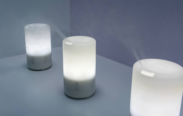 istock Electric aroma oil diffuser on wooden floor. Selective focus 904358842