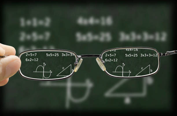 blurry vision of a chalkboard corrected by the glasses stock photo