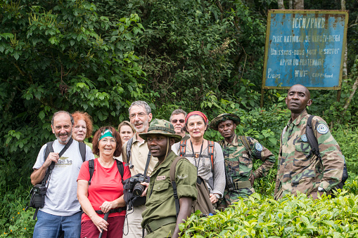 Kahuzi Biega National Park, Democratic Republic of Congo - January 2, 2016: A group of western tourists together with the Congolese national park rangers during their safari walk to the Eastern Lowland Gorillas. Kahuzi-Biega National Park is in eastern Democratic Republic of the Congo, 50 km west of the town of Bukavu in the Kivu Region, near to the western side of Lake Kivu and the Rwandan border. The park is one of the last refuges of the rare Eastern Lowland Gorilla.