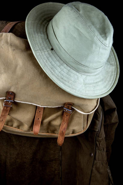 istock Coat Game Bag and Hat on Black Background 904371790