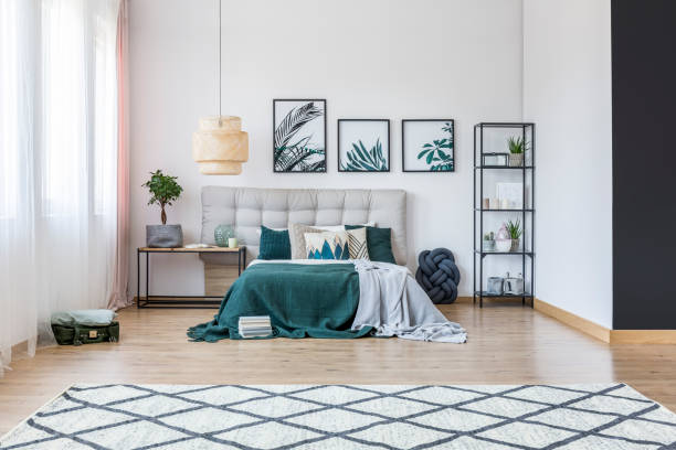istock Spacious bedroom with leaves posters 904379782