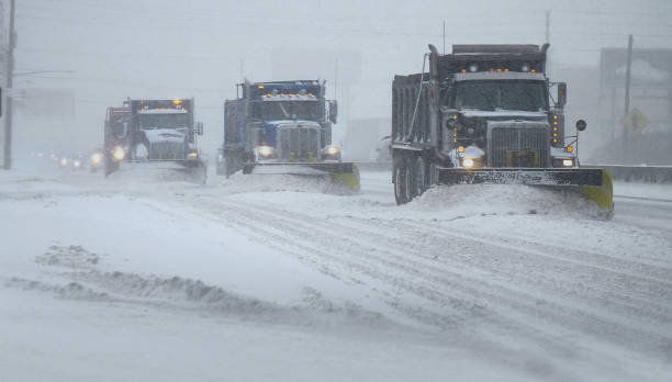 Blizzard road work stock photo