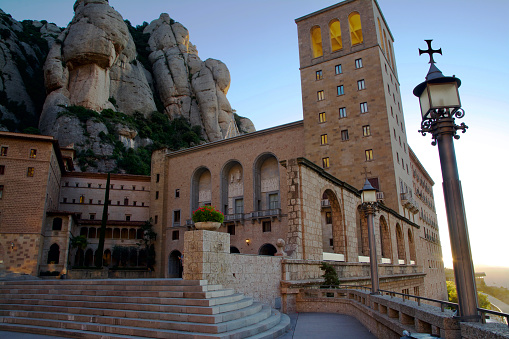 Sunrise at the Heart of the Sacred Montserrat Abbey. A Pilgrimage Destination in Mountains of Catalonia near Barcelona, Spain