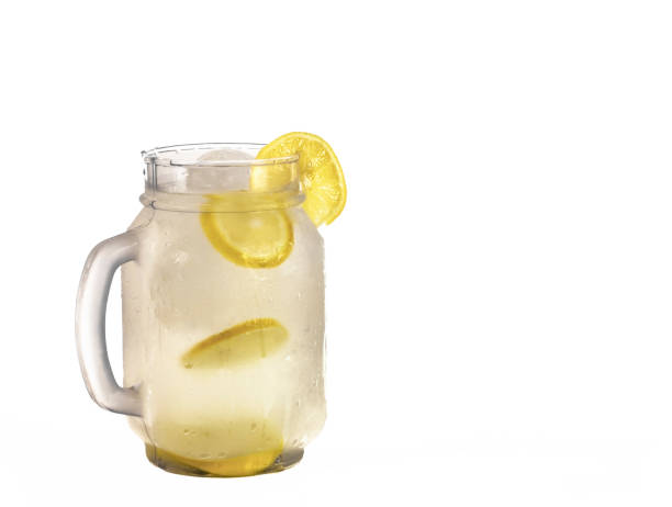 istock Fresh squeezed lemonade in a clear glass or cup with ice cubes and lemonade slices. 904407058