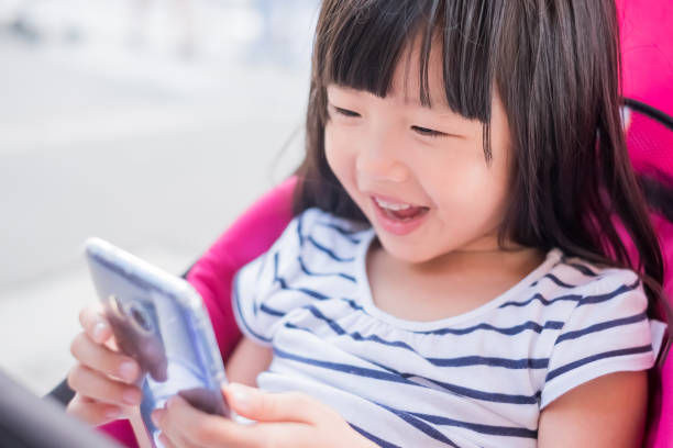 istock cute girl use phone 904407304