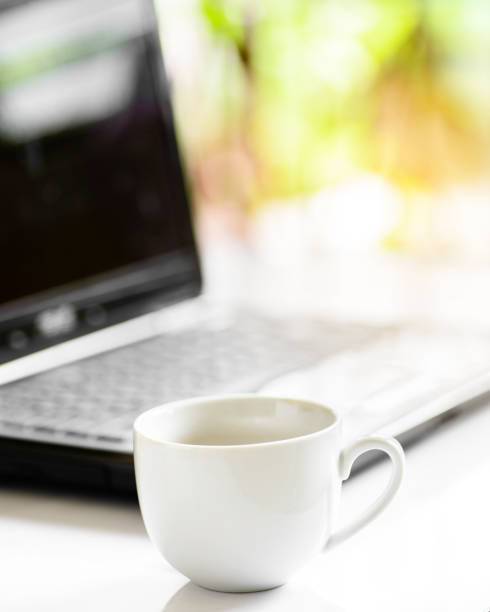istock Coffee cup and laptop for business, Selective focus on coffee. 904420648
