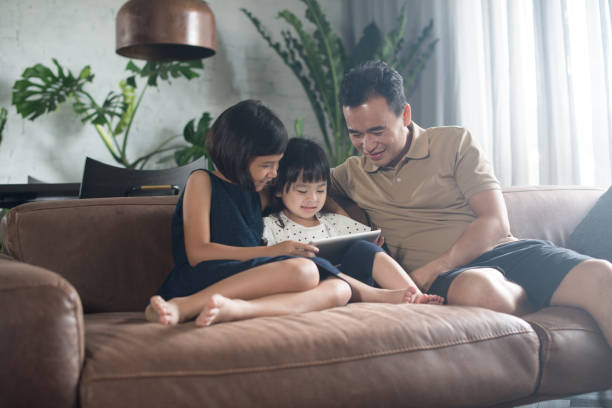 istock Asian family spending time together at home. 904423388