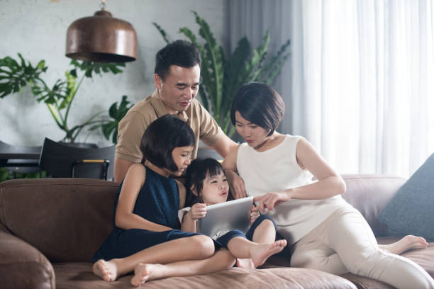 istock Asian family spending time together at home. 904423392