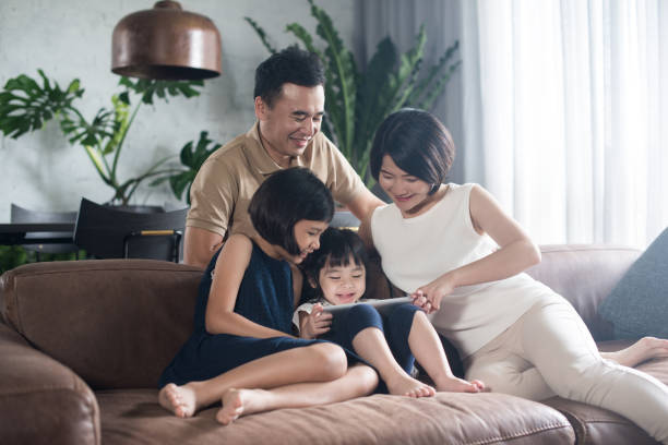 istock Asian family spending time together at home. 904423446