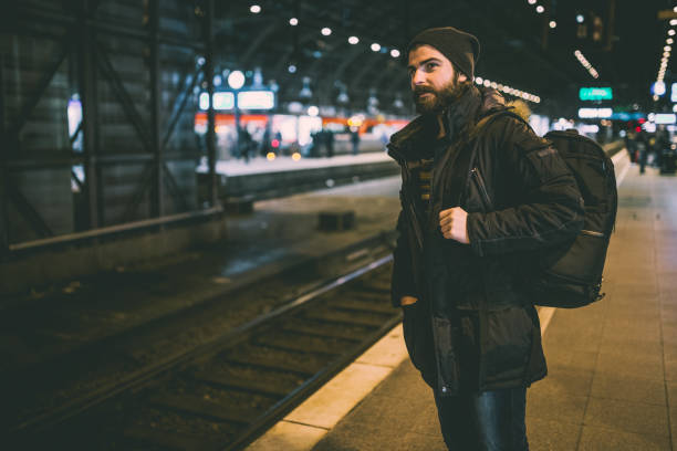istock Young man at the railroad station travel through Germany 904423764